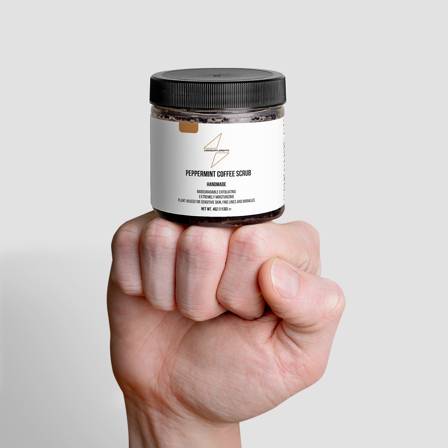 1000Supplements Peppermint Coffee Scrub on fist